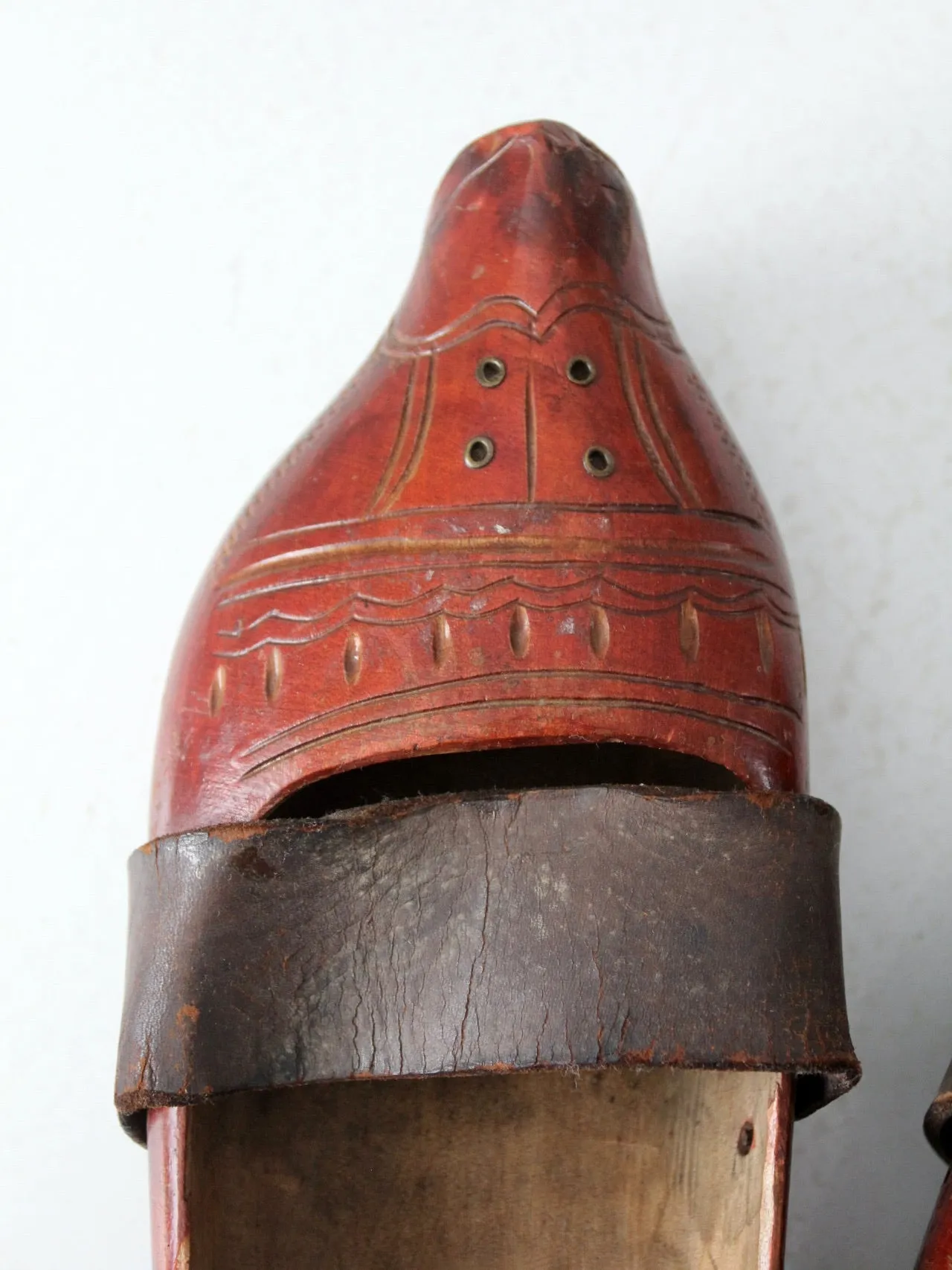 antique carved wood clogs