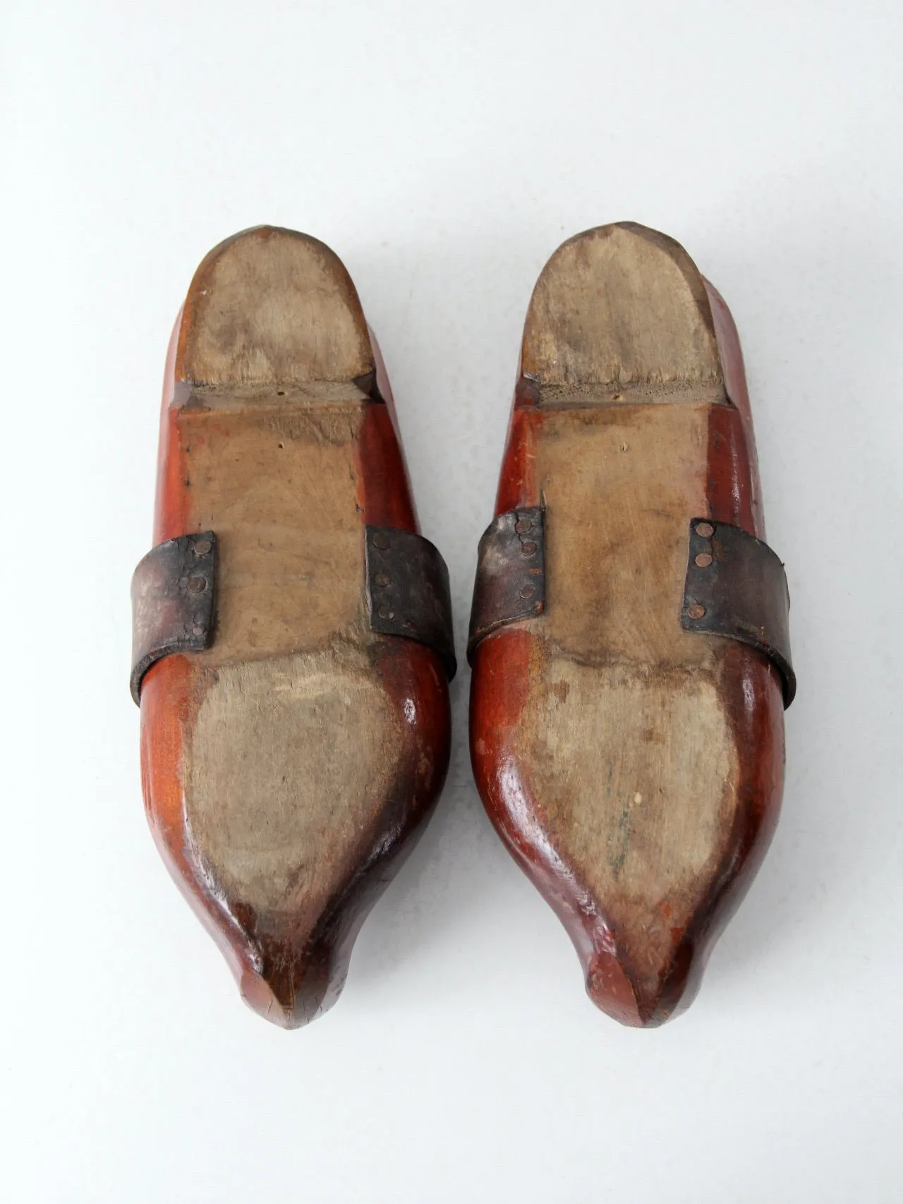 antique carved wood clogs